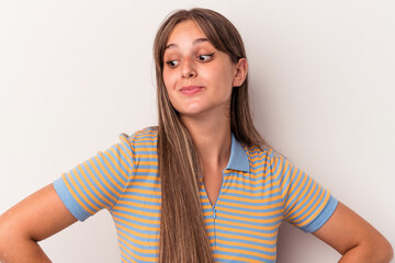 Young caucasian woman isolated on white background dreaming of achieving goals and purposes