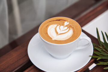 Hot art latte in white cup 