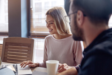 Business team working together at desk in office