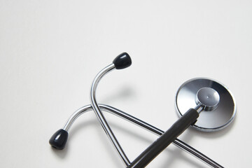 Medical stethoscope on white background