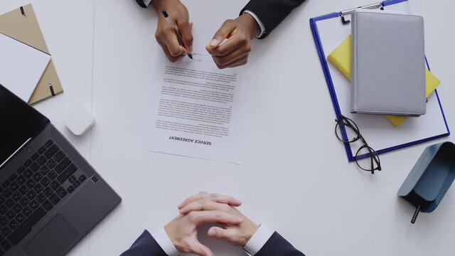 Service provider and customer signing service agreement with lorem ipsum text