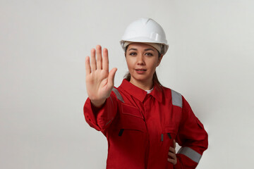 Portrait of a woman worker with hand stop gesture