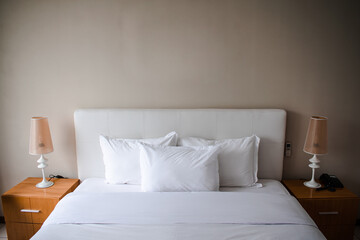 Hotel room Interior, bed and lamps.