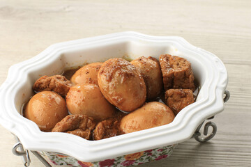 Semur Telor is Boiled Eggs Cook with Soy Sauce for Family Menu on White Table