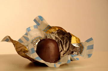 chocolate truffle with open packaging
