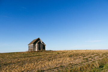 Fototapeta na wymiar An old country church in the Great Plains during sunset with fall colors in North Dakota.