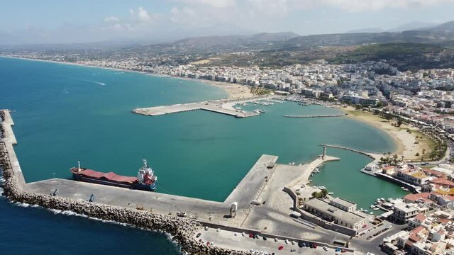 Crete, Greece. Harbor with marine vessels, boats and lighthouse. Rethymno