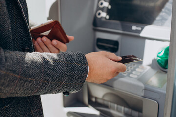 Man withdrawing money from atm