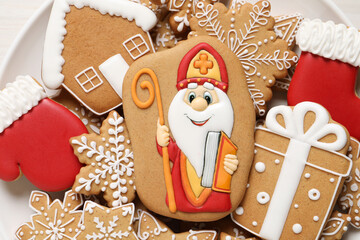 Tasty gingerbread cookies on plate, top view. St. Nicholas Day celebration