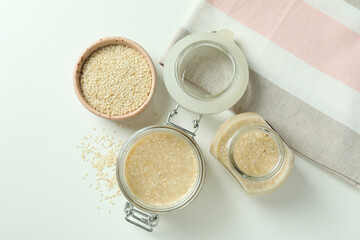 Concept of tasty food with tahini sauce on white background