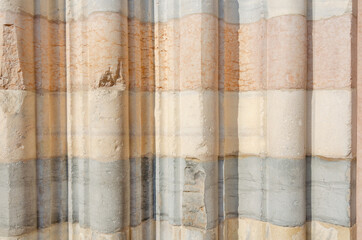 Unusual old marble background composed of different color stripes and rounded blocks
