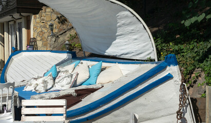 Sofa decorated from an old fishing boat for an outdoor gazebo. The second life of old things