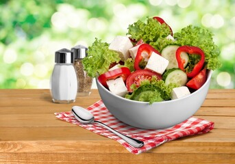 Healthy Homemade vegetables Salad in the bowl on a desk