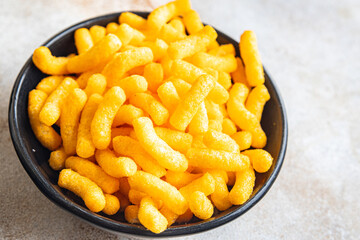 corn sticks bacon flavor cheetos fast food meal snack on the table copy space food background rustic. top view