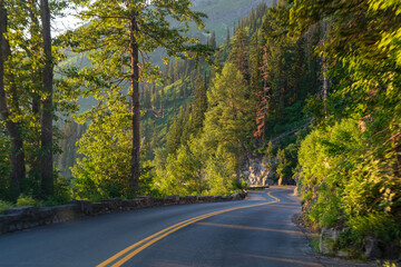 Golden hour, as viewed while driving on the Going to the Sun Road in Glacier National Park in Montana on a beautiful sunny summer evening