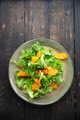 salad orange fillet green leaves mix arugula, spinach, lettuce meal snack on the table copy space food background keto or paleo diet veggie vegan or vegetarianism