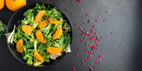 salad orange fillet green leaves mix arugula, spinach, lettuce meal snack on the table copy space food background keto or paleo diet veggie vegan or vegetarianism