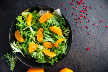 salad orange fillet green leaves mix arugula, spinach, lettuce meal snack on the table copy space food background keto or paleo diet veggie vegan or vegetarianism