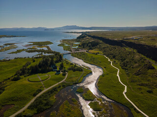 View of Thingvellir national park, Iceland's parliament, the Thingvellir Church and the ruins of old stone shelters, hikes and lake