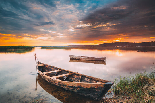 Braslaw Or Braslau, Vitebsk Voblast, Belarus. Wooden Rowing Fishing Boats In Beautiful Summer Sunset On The Dryvyaty Lake. This Is The Largest Lake Of Braslav Lakes. Typical Nature Of Belarus