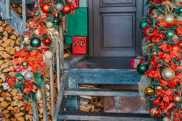 House entrance decorated for holidays. Christmas decoration. garland of fir tree branches