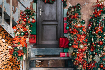 House entrance decorated for holidays. Christmas decoration. garland of fir tree branches