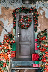 House entrance decorated for holidays. Christmas decoration. garland of fir tree branches