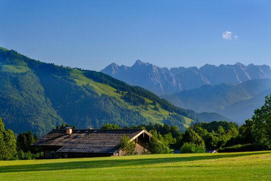 Germany, Bavaria, Reit im Winkl, Lone mountain hut in scenic Chiemgau Alps