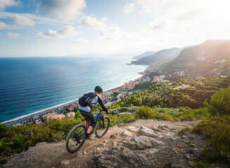 Athlete riding bike on mountain