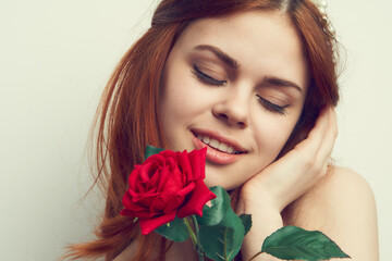 beautiful red-haired woman rose flower close-up charm