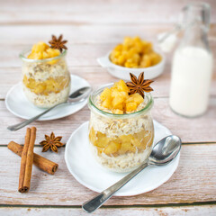 Overnight porridge with apples, cinnamon and maple syrup.