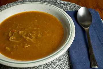 Soup plate. Plate with cabbage broth, a spoon and a napkin