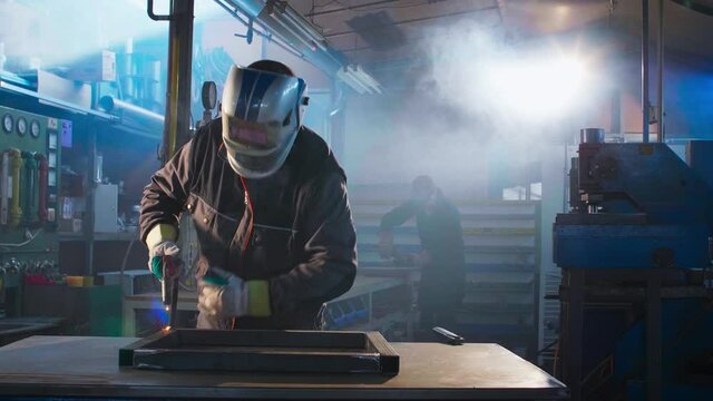 Portrait of a welder posing in a workshop