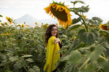 beautiful woman on a field of sunflowers