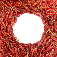 red cayenne pepper, frame made of dry chili, food background with copy space, top view