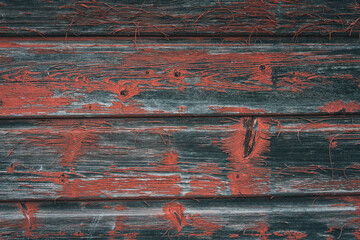 worn wooden wall with red paint