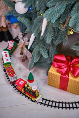 A Toy Train Set on the railroad under the Christmas tree