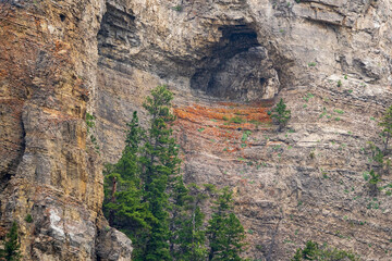A high cave in the cliffs by the Missouri River at Gates of the Mountains Wilderness near Helena, Montana