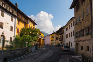 Fototapeta na wymiar The main road which runs through the small town of Ampezzo in Udine Province, Friuli-Venezia Giulia, north east Italy 