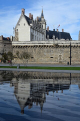 Medieval castle reflecting in the water. Nantes, France.