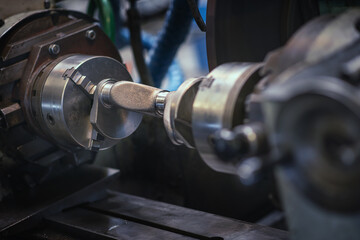 Fototapeta premium Metal machine tools industry. CNC turning machine high-speed cutting is operation