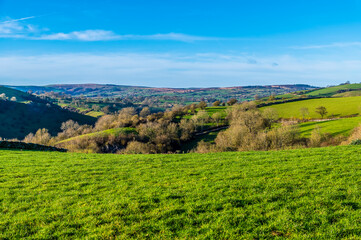 A view across the countryside down into the Manifold Valley next to the village of Wetton, UK on a sunny Autumn day