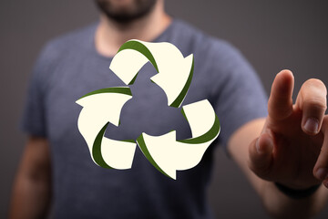 hand holding green recycle symbol