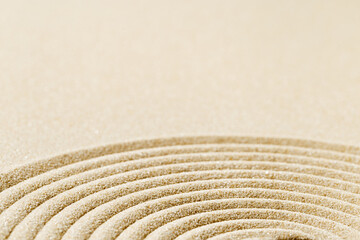 Fototapeta na wymiar Pattern in Japanese Zen Garden with close up concentric circles on sand Aesthetic minimal