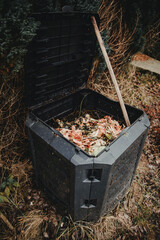 black plastic composter bin for kitchen and garden leftovers