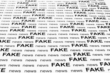 FAKE news - printed on white sheet of paper