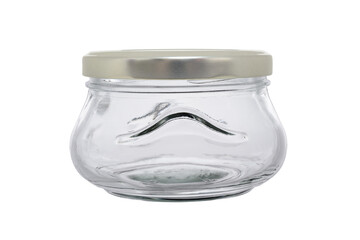 An empty glass jar of a wide shape, closed with a metal lid. On a white background, close-up