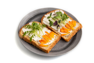 White bread sandwiches with cream cheese, calendula and microgreen isolated on white. side view, close up.
