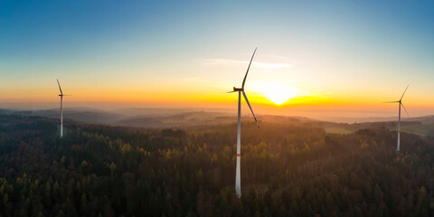 Aerial panorama of wind farm in forested Schurwald range at sunset