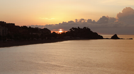 Sunrise on the Mediterranean coast, next to the beach and rock of San Cristobal, Almunecar, Costa...